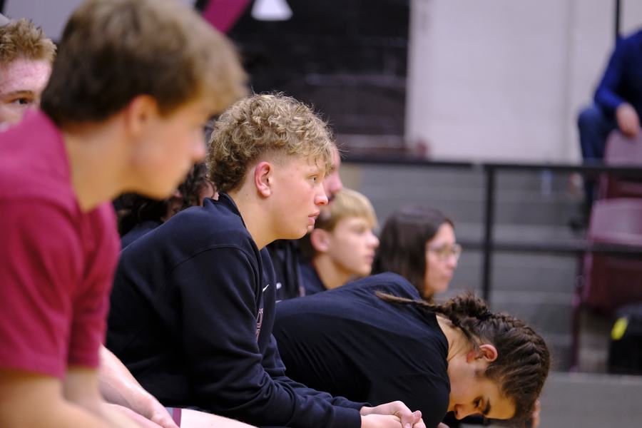 Edmond wrestlers watching the action from the bench