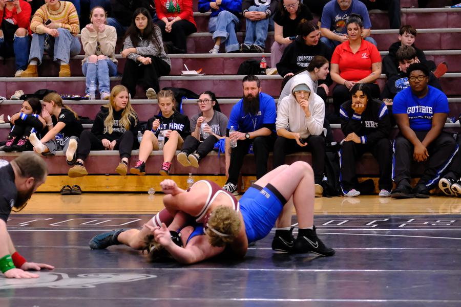 An Edmond wrestler works for a fall in front of the home crowd